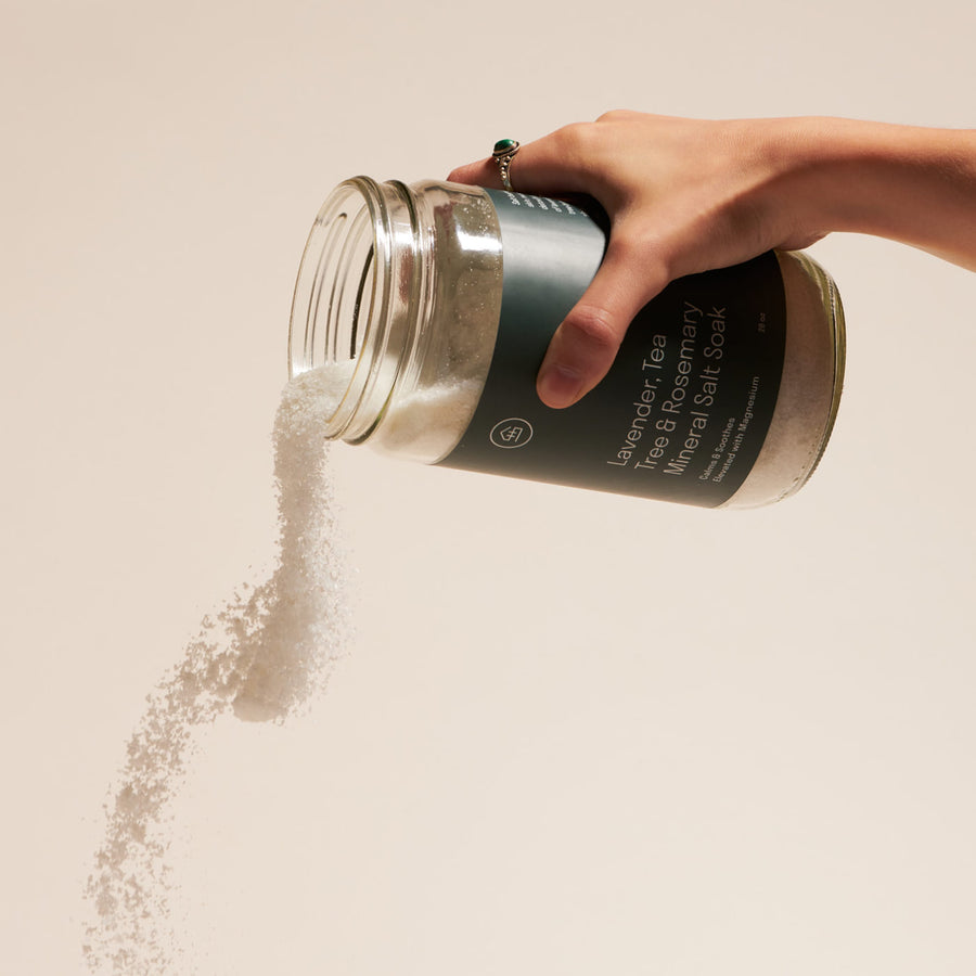 Person pouring Lavender & Tea Tree Mineral Bath Soak