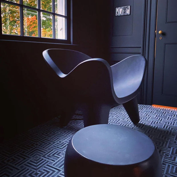 Apollo side table and chair in a dark bathroom
