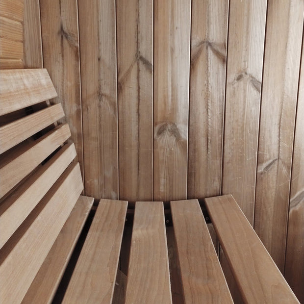 Interior detail shot of the curved bench of the SaunaLife barrel sauna