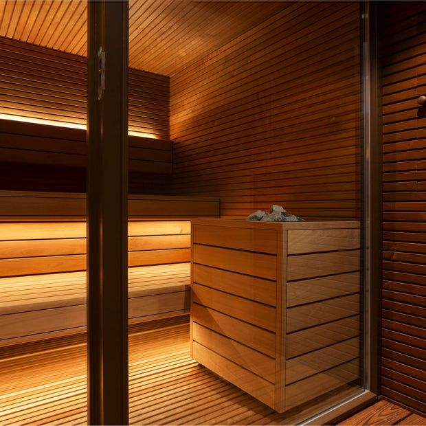 Up close of a heater and the benches inside the Arti sauna cabin