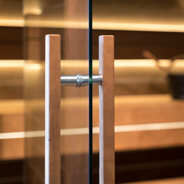 Up close of the premium tempered glass door and stainless steel/wood door handle