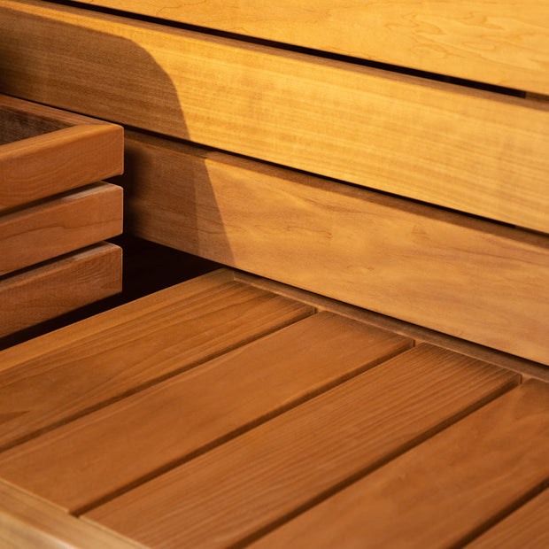 Up close of wood detailing for the bench seating inside the sauna cabin