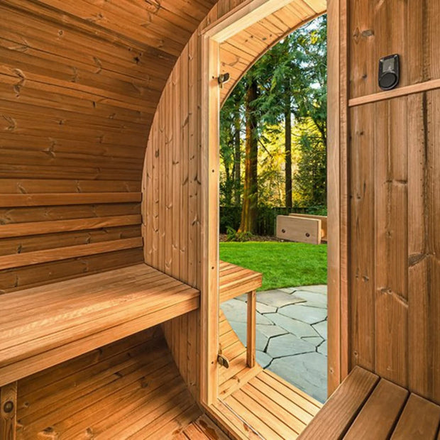 Inside of the barrel sauna with oorch looking out through the front door