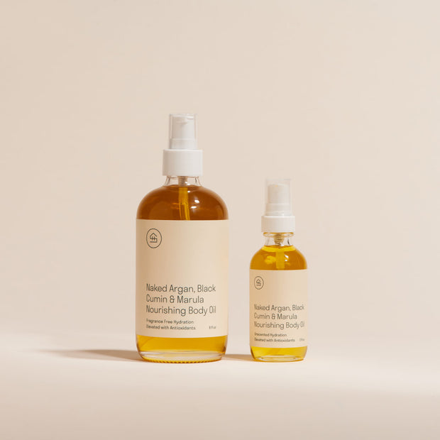 Side by side view of the mini and full size Naked Argan & Marula Body Oil