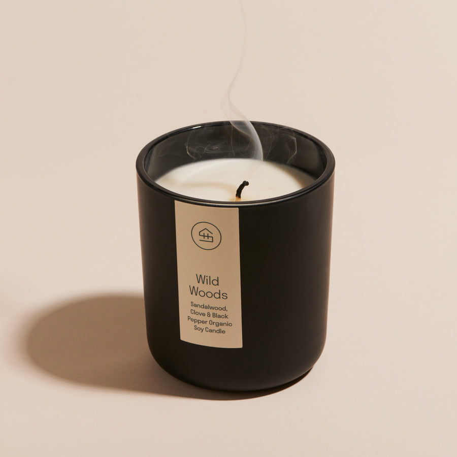 Smoke rising from a freshly blow out Wild Woods Organic Soy Wax Candle